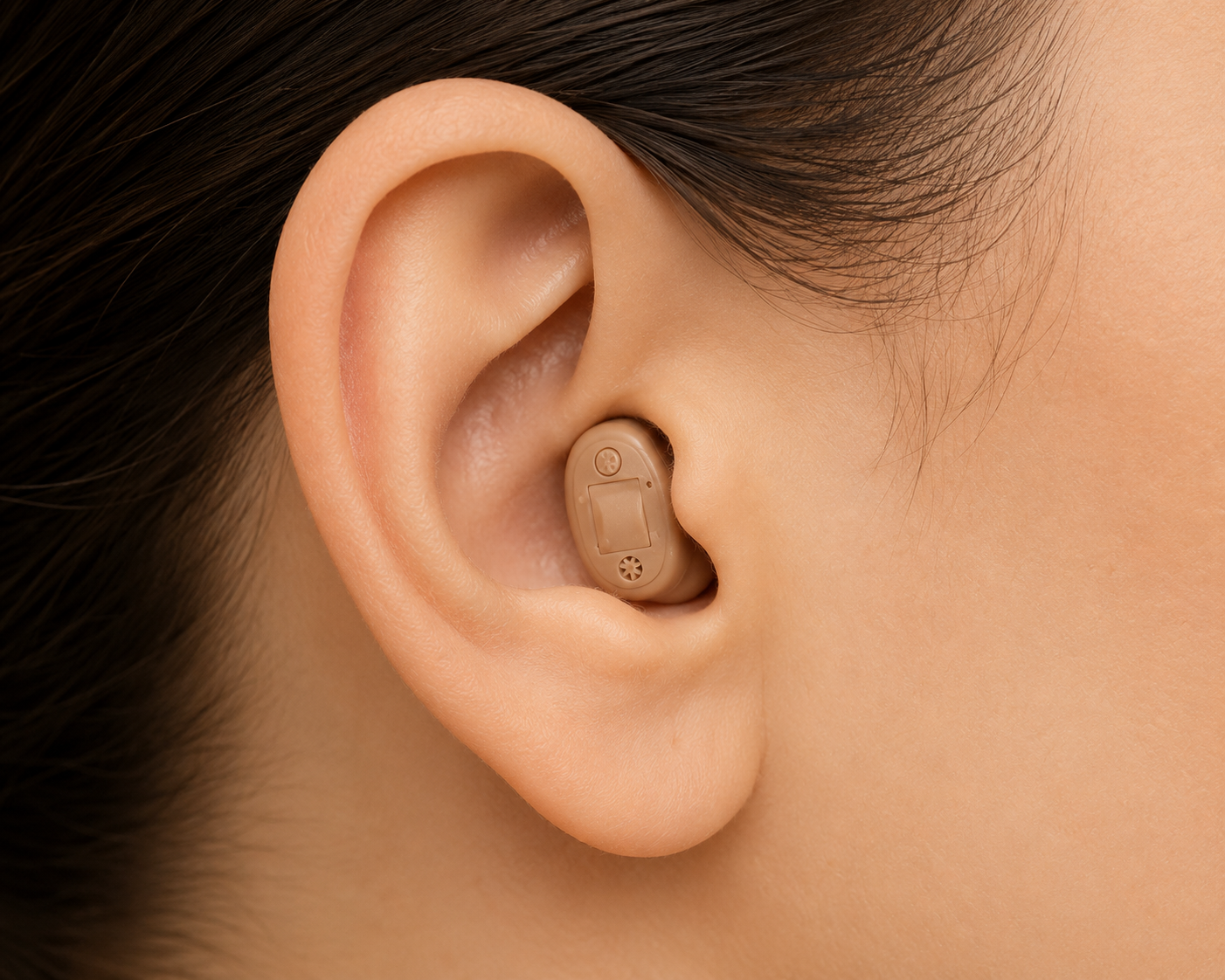 Close-up of an invisible-in-canal (IIC) hearing aid